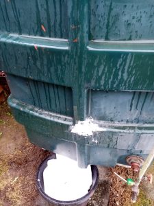 An oil tank that has failed and has had soap rubbed into the crack. 